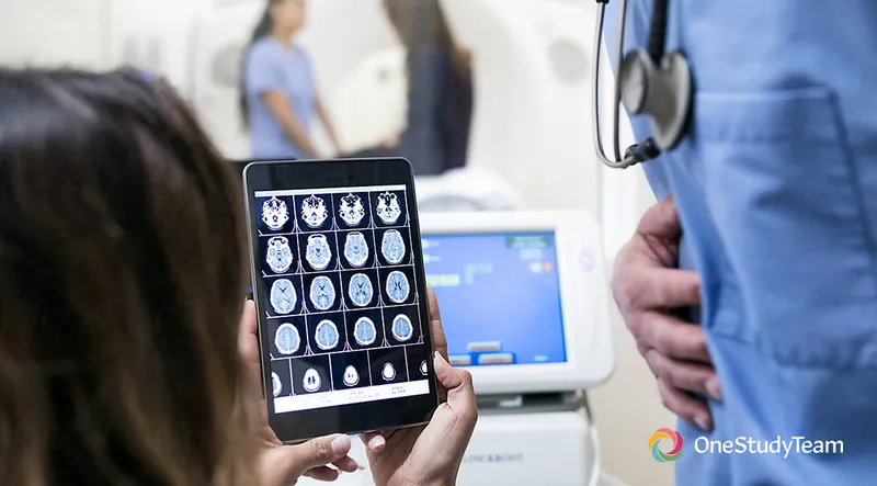 People viewing brain images on a tablet